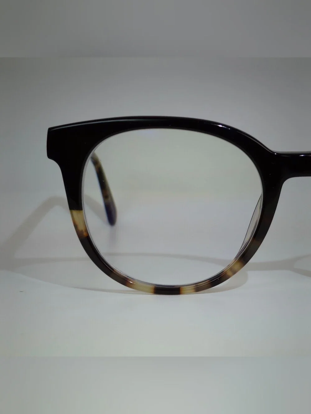 Rialto. Classic Round Black Upper, Animal Print Lower And Temples.